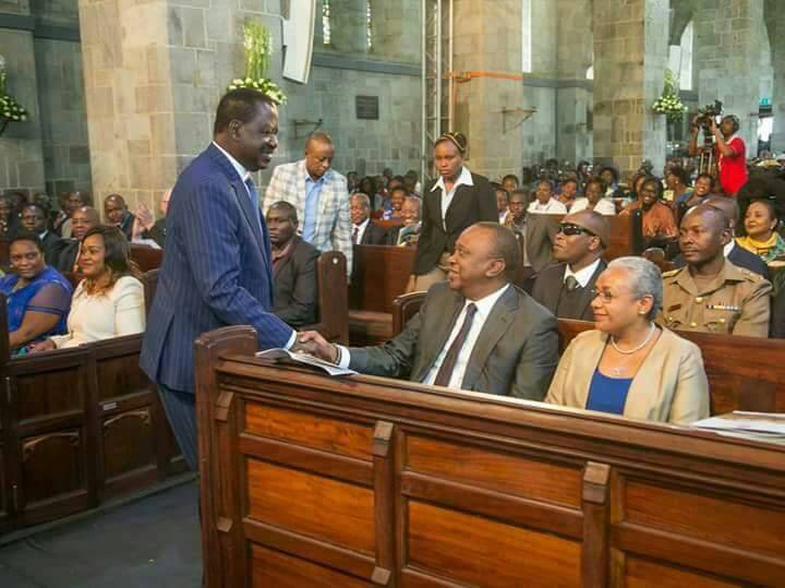 Opposition leader Raila Odinga shakes hands with President Uhuru Kenyatta